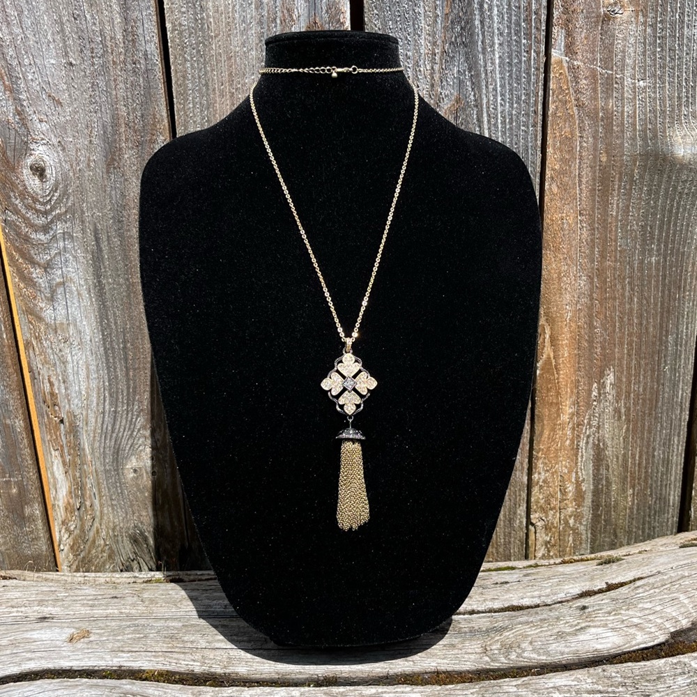 Gold necklace with pendant and tassel
